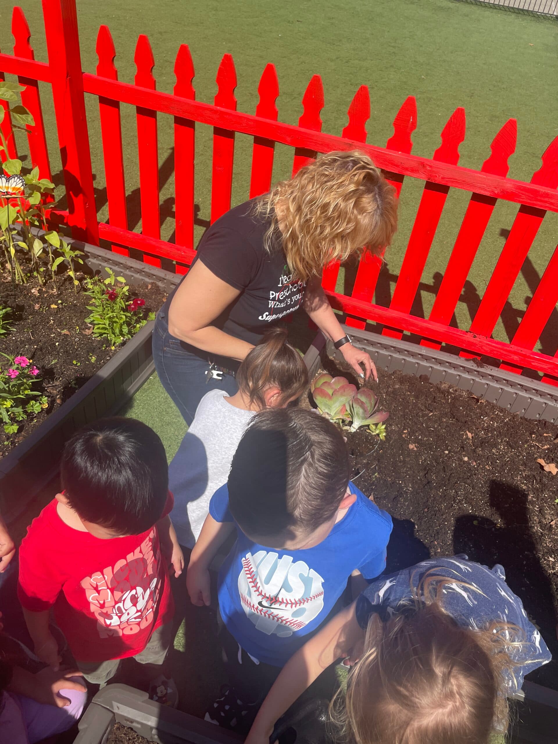 Children gathered together for a group gardening activity