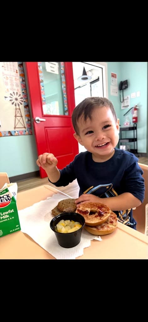 Toddler enjoying snack time
