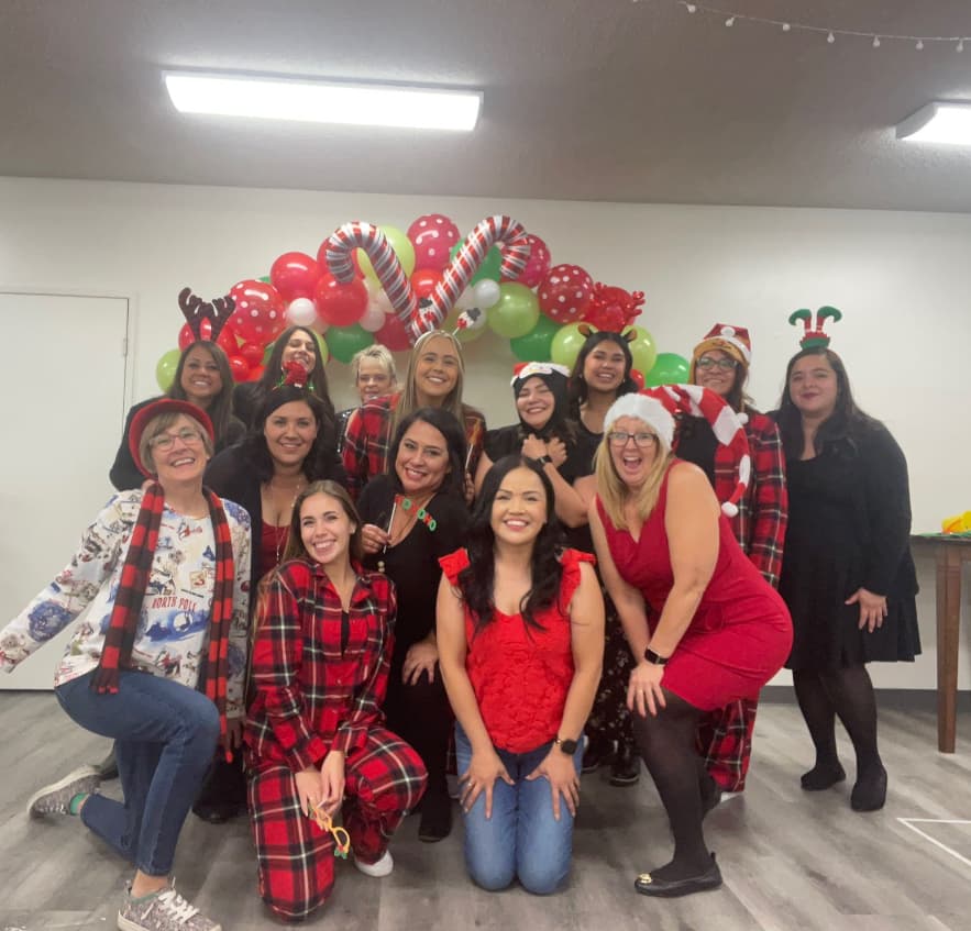 The Little Explorers Academy team celebrating together