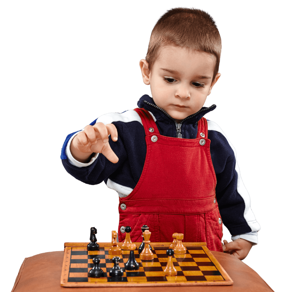 A young student playing chess during after-school enrichment