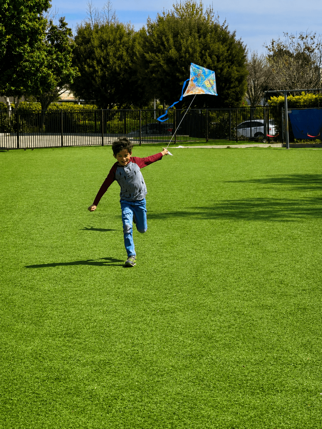 Students playing on the field at Little Explorers Academy in Riverside, CA