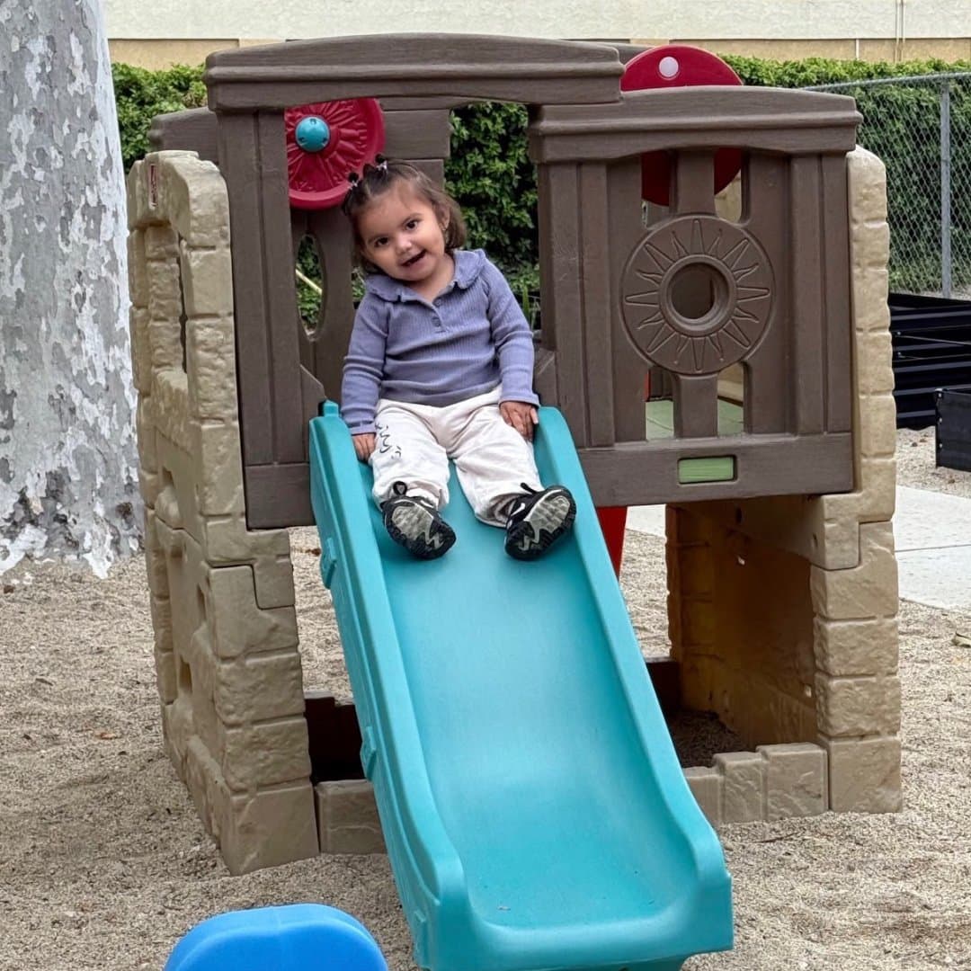 A toddler playing at Little Explorers Academy in Riverside, CA