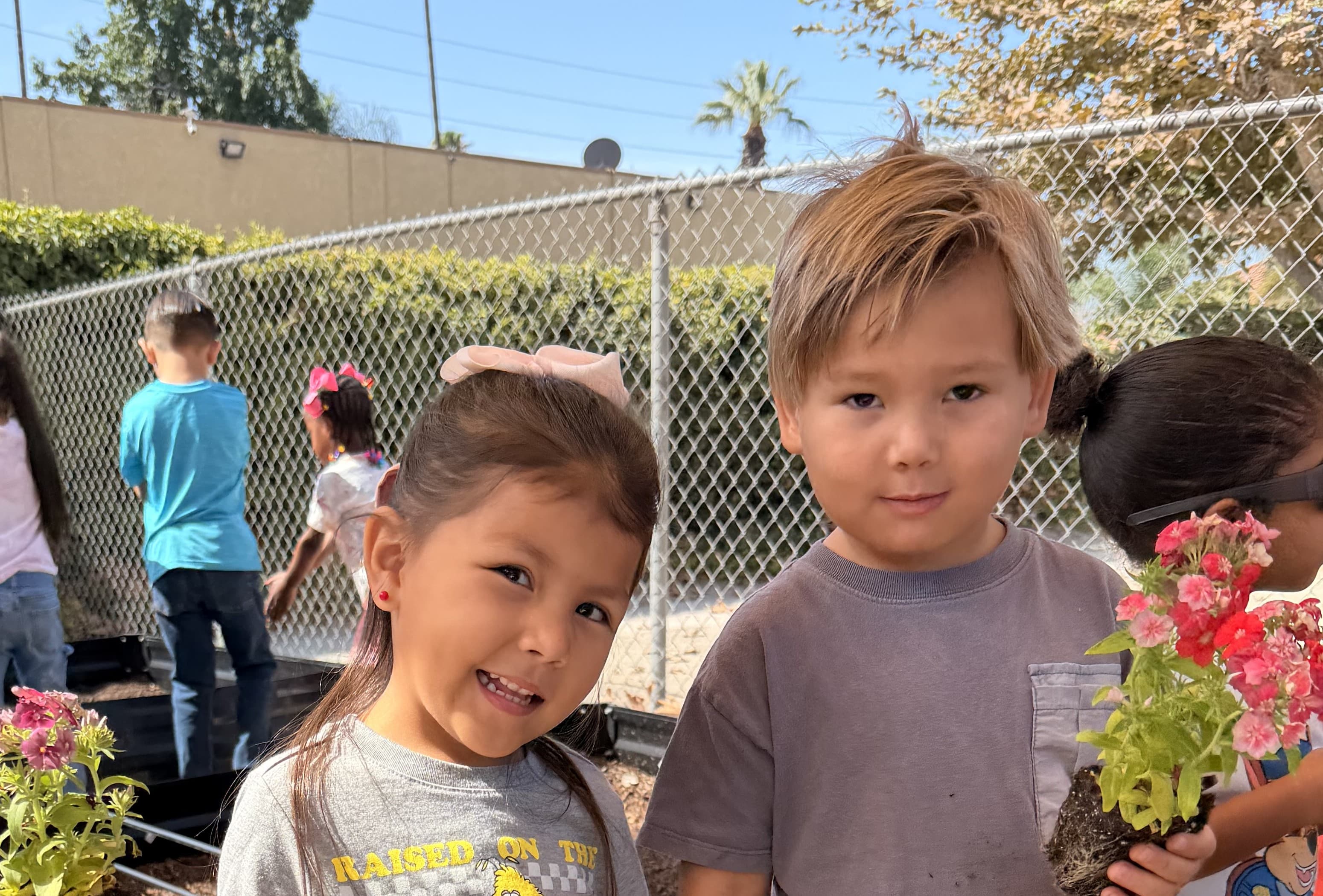 Pre-K student writing letters